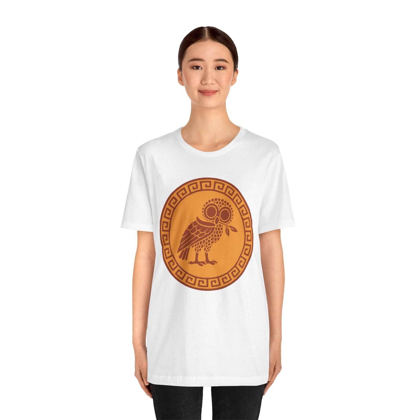 Person wearing a white t-shirt with a brown owl design on a white background