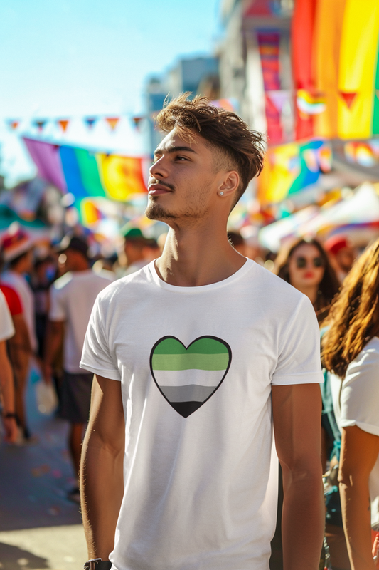 Aromantic Pride Heart T-Shirt – Minimalist Aro Flag LGBTQIA+ Tee in white, worn by a man walking through a vibrant pride parade. Design features a heart filled with the aromantic flag. Keywords: aromantic heart, aromantic pride merch, aromantic shirt.