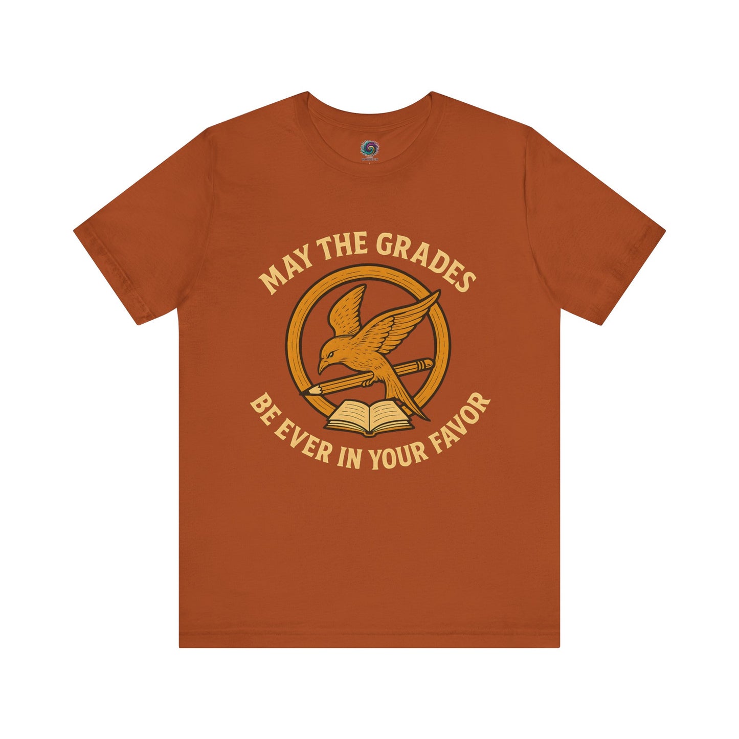 Burnt Orange "May the Grades Be Ever In Your Favor" by WhimSpin. The image on the shirt features a parody of the Mockijay design from the covoer of the Hunger Games books