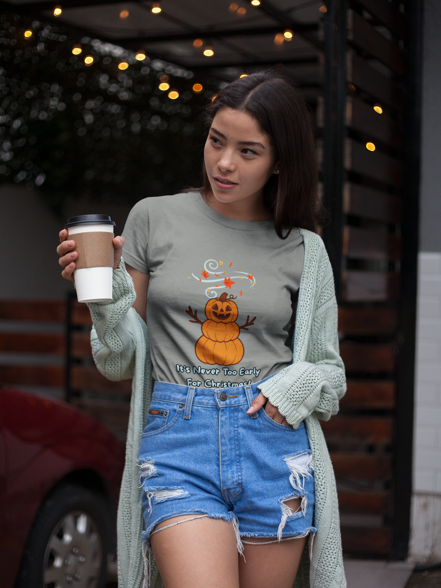 Pumpkin Snowman T-Shirt – It’s Never Too Early for Christmas graphic in soft grey, modeled outdoors as a fun Halloween snowman shirt blending fall and winter holidays.