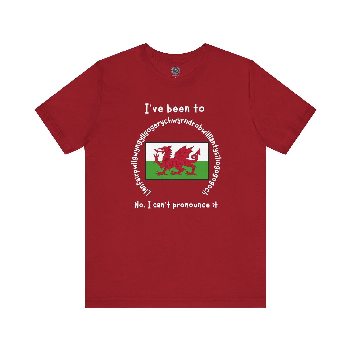 Llanfairpwllgwyngyllgogerychwyrndrobwllllantysiliogogogoch T-Shirt – Funny Wales Travel Merch in canvas red with bold white lettering and centered Welsh flag graphic.