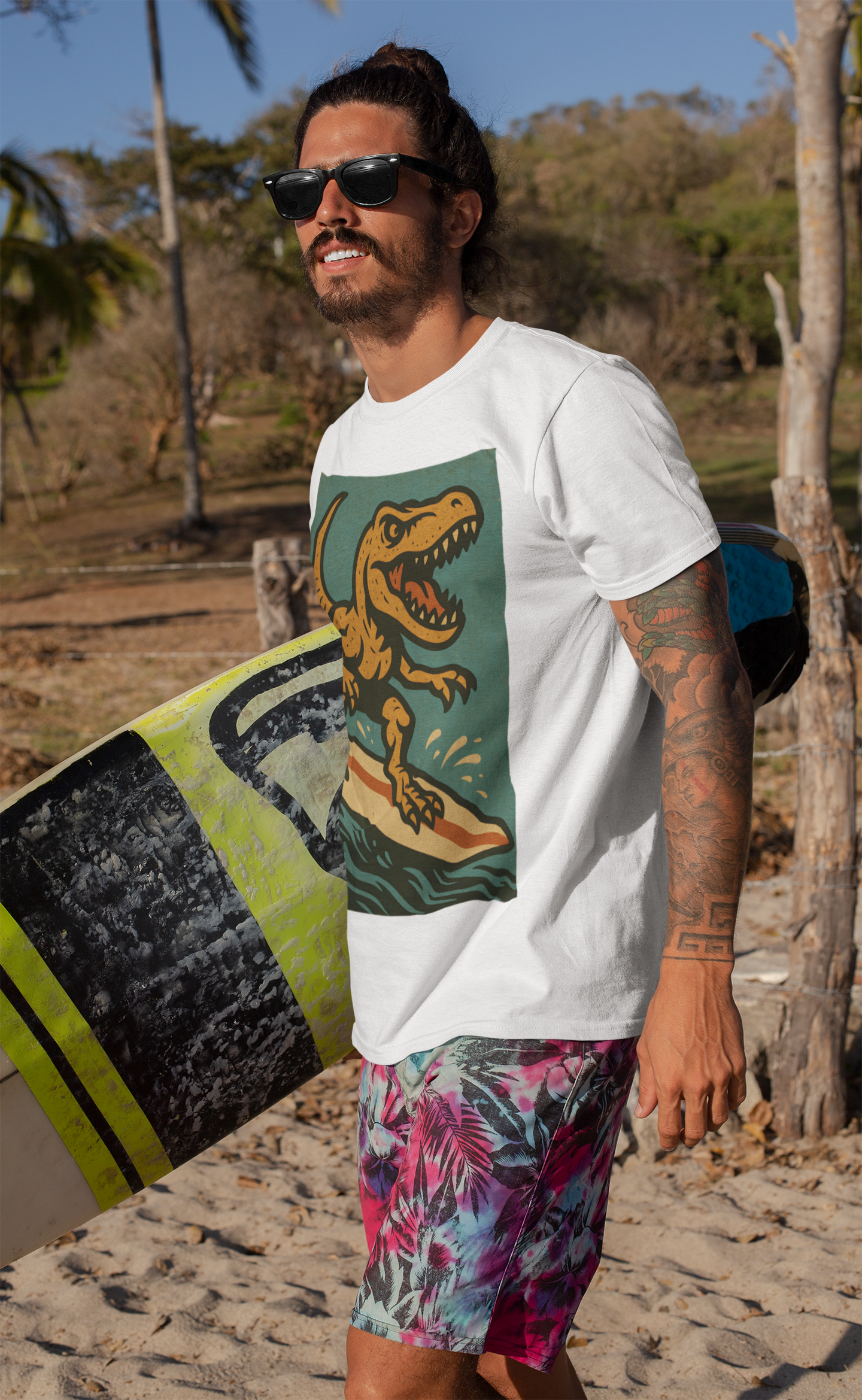 Surfing T-Rex T-Shirt – Funny Dinosaur Graphic Tee for Summer Vibes worn during a tropical surf trip, combining dinosaur surfing fun with laid-back beach style