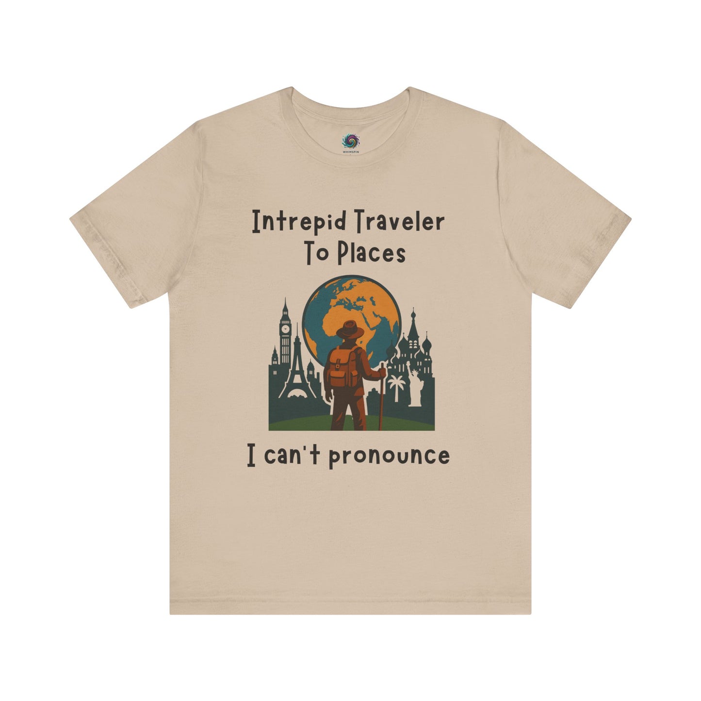 Beige t-shirt with travel-themed graphic and text "Intrepid Traveler to Places I Can't Pronounce" on a white background