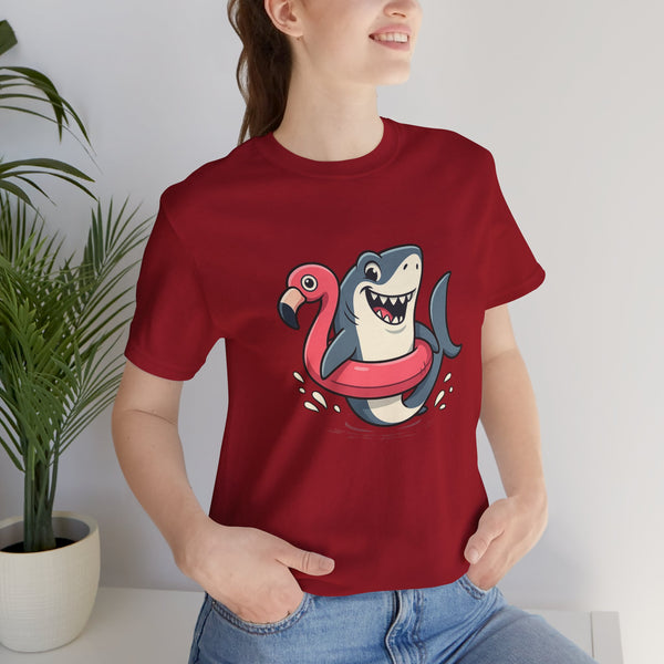 Red crewneck T-shirt with cartoon shark hugging a pink flamingo graphic on front