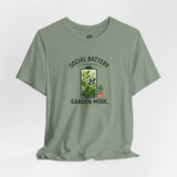 Sage green crew-neck T-shirt with “SOCIAL BATTERY” plant and “GARDEN MODE” text