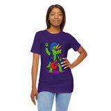 Purple crewneck graphic dinosaur t-shirt with triceratops playing guitar, worn by woman