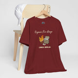 Maroon crew-neck T-shirt on hanger with chicken and egg “CRACK DEALER” graphic