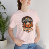 Soft pink crew-neck T-shirt with “High Priestess of Pumpkin Spice” pumpkin emblem