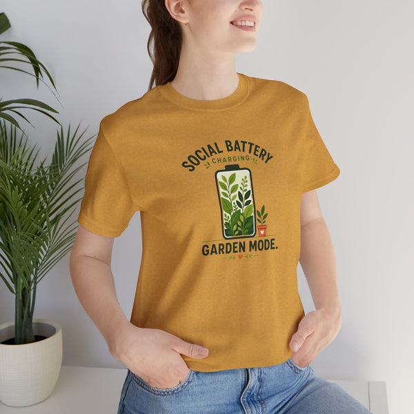 Mustard yellow crewneck T-shirt with front plant graphic and “Social Battery” line.
