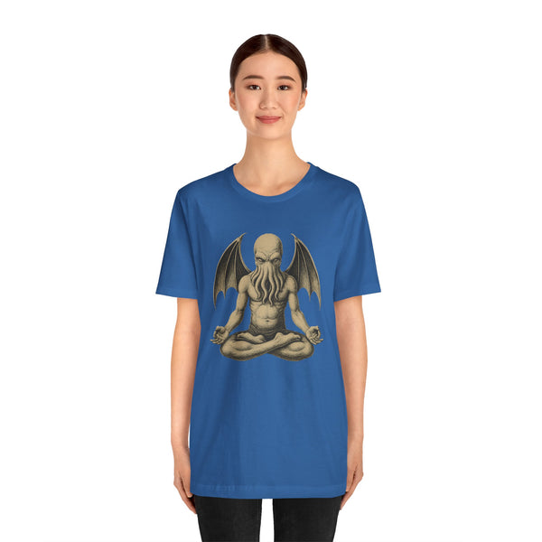 Blue unisex graphic T-shirt with meditating monster illustration at center chest