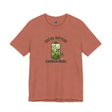 Rust red T-shirt with 'Social Battery Charging' and 'Garden Mode' plant graphic