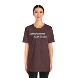 Heather maroon T-shirt with white text graphic: “Consciousness is an illusion”.