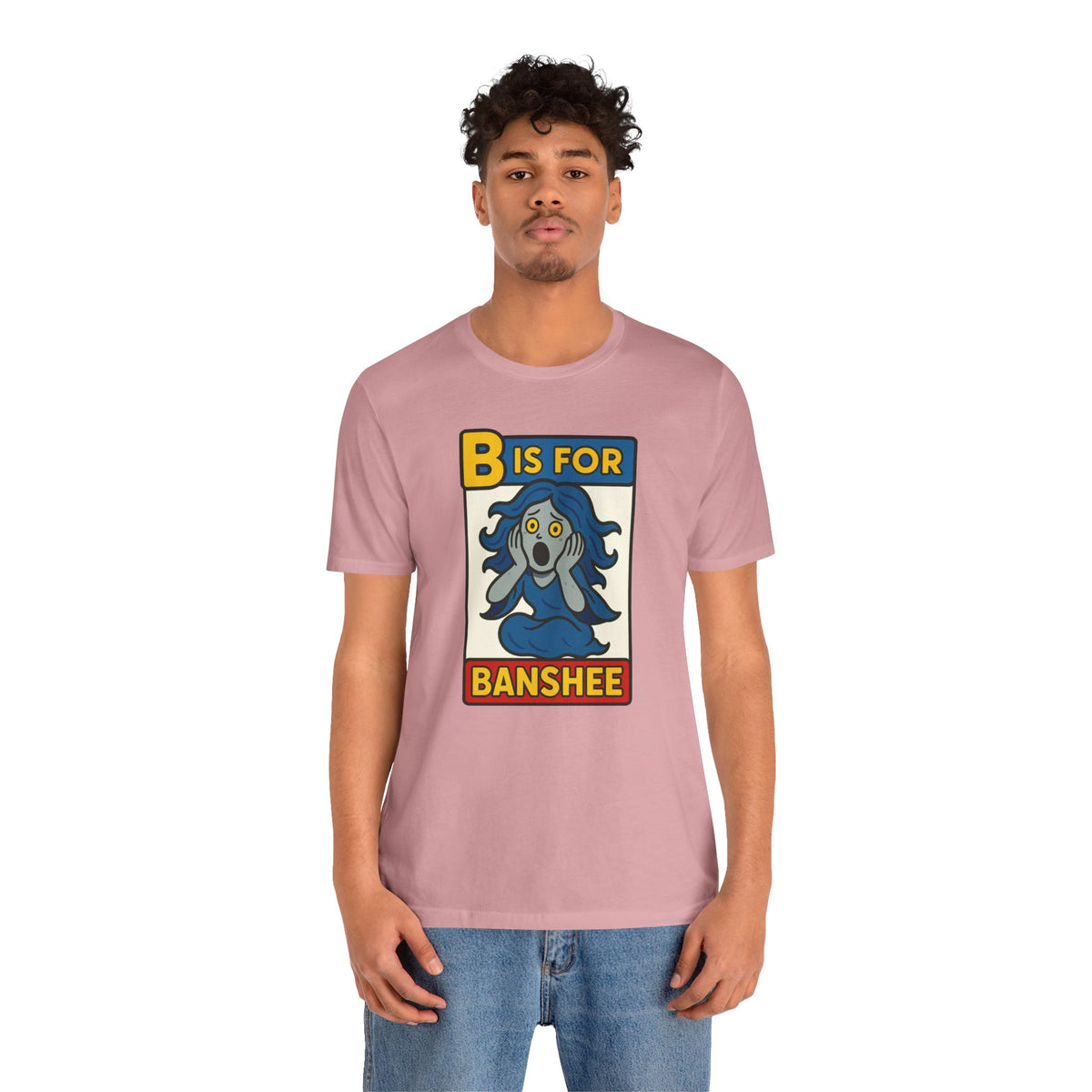 Pink t-shirt on model with front “B is for Banshee” alphabet graphic.
