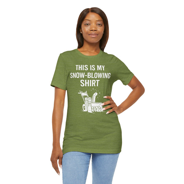 Green crew-neck graphic T-shirt with snow-blowing text and snowblower icon, hand on hip