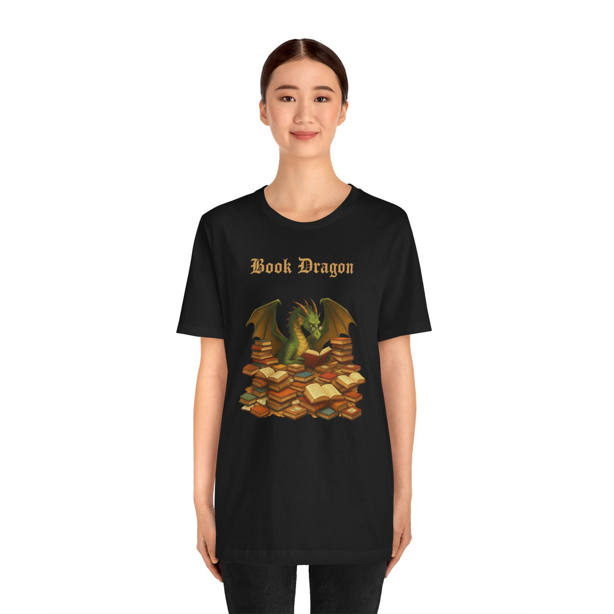 Black crewneck T-shirt on a model; “Book Dragon” logo with dragon and stacked books