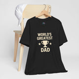 Black crew-neck T-shirt on hanger with “World’s Greatest Dad” trophy graphic