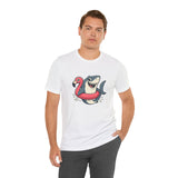White crew-neck T-shirt displaying shark and flamingo float cartoon graphic