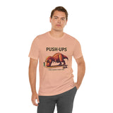 Beige crewneck T-shirt with 'PUSH-UPS' T-rex workout graphic, side pose