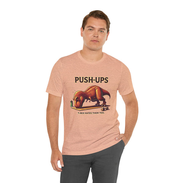 Beige crewneck T-shirt with 'PUSH-UPS' T-rex workout graphic, side pose