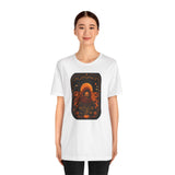 White crewneck T-shirt with orange pumpkin sci-fi face graphic on the front