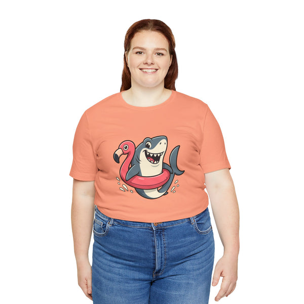 Coral crewneck T-shirt with shark and flamingo floatie graphic on chest