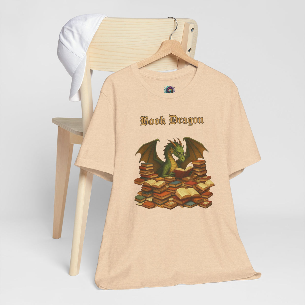 Tan crew-neck t-shirt with Book Dragon graphic on the front
