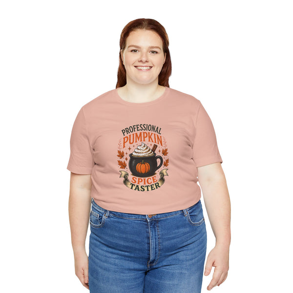 Light pink crewneck t-shirt with pumpkin-spice badge graphic centered on chest