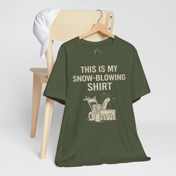 Dark green snow-blowing T-shirt on hanger with rainbow icon and “THIS IS MY SNOW-BLOWING SHIRT”