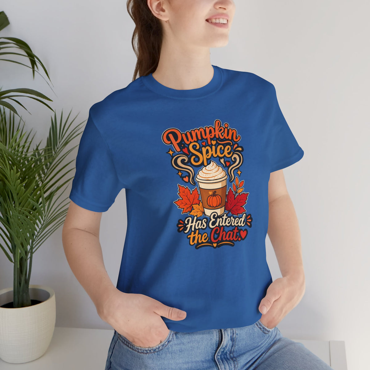 Blue T-shirt with centered fall pumpkin coffee graphic and text, worn with jeans