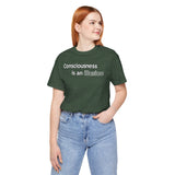 Dark green heather t-shirt with white “Consciousness is an illusion” print, side view