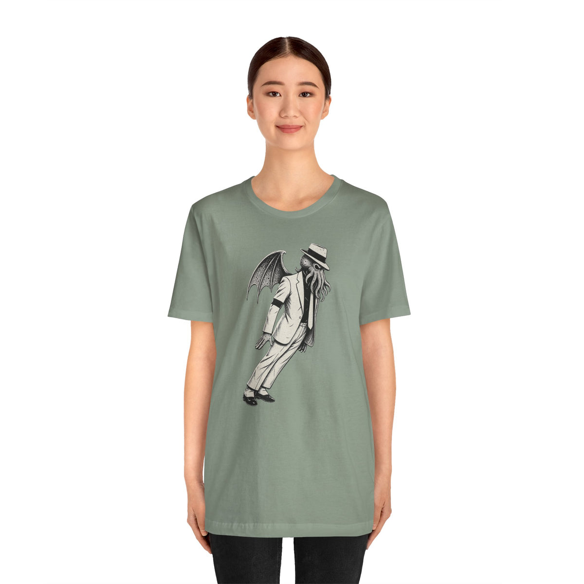Sage green crew-neck T-shirt featuring a front graphic of a top-hat figure with wings
