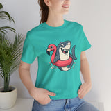 Teal crew-neck T-shirt with shark and flamingo floatie graphic on chest