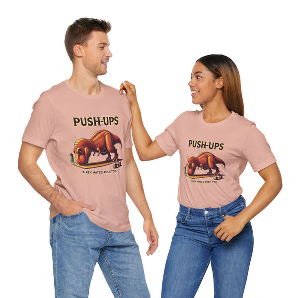 Pink T-shirt with dinosaur push-ups graphic and text across the chest