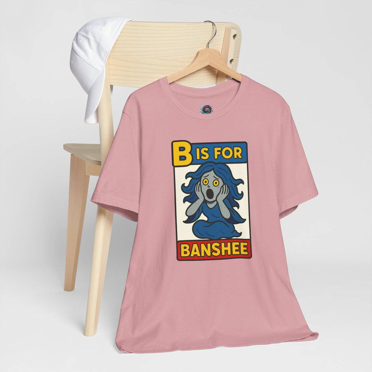 Pink t-shirt with “B is for Banshee” alphabet graphic on the front.