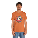 Orange crewneck T-shirt with shark and flamingo floatie graphic, male model front.