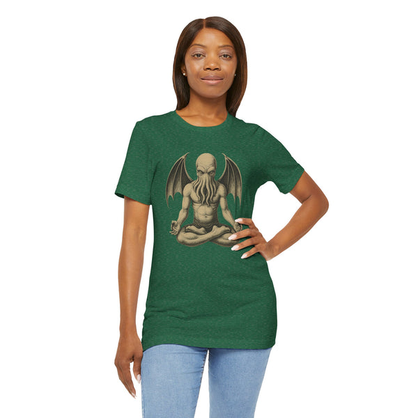 Green unisex T-shirt with meditating monster graphic and bat-like wings design