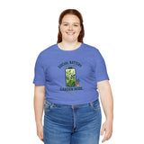Blue crew-neck T-shirt on model, “Social Battery” garden mode text and plant graphic