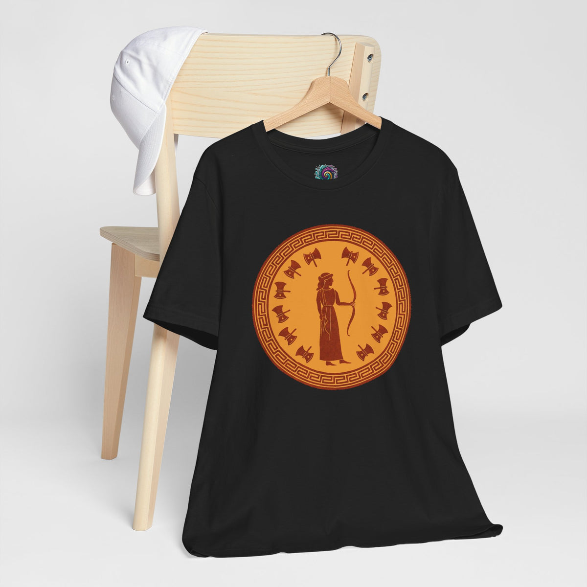 Black crewneck t-shirt with orange circular goddess emblem printed on front