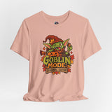 Dusty pink crew-neck graphic t-shirt with colorful goblin seasonal emblem