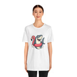 White crew-neck T-shirt featuring a smiling shark on a flamingo float graphic
