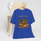 Blue t-shirt with dragon and book stack graphic, worn front view on hanger