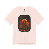 Soft pink graphic T-shirt with orange “Pumpkin” sci-fi spice face print on chest