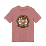 Dusty rose crewneck t-shirt with pumpkin-spice themed badge graphic on the chest