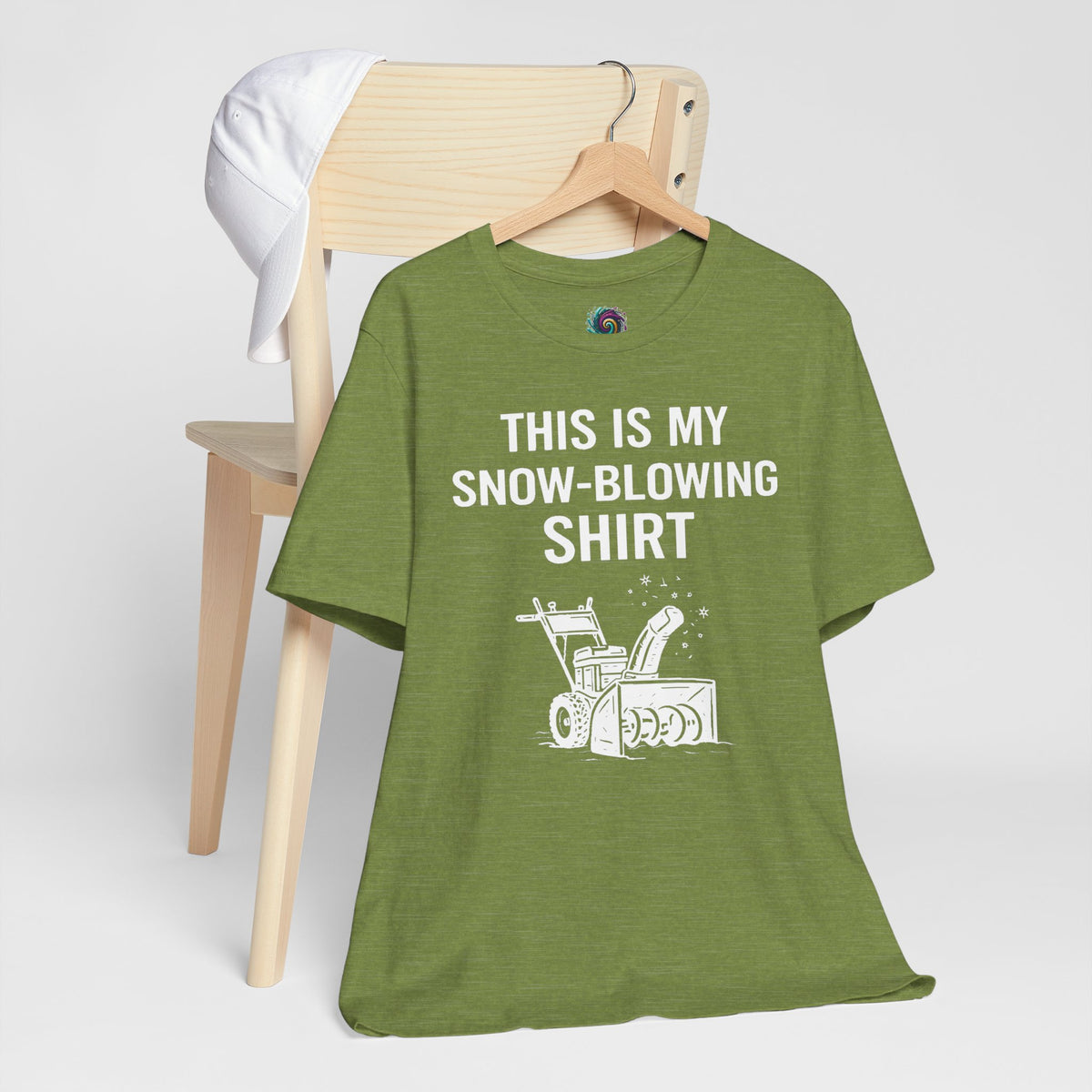 Green crew-neck graphic T-shirt with snow-blowing text and snowblower icon