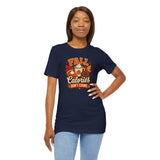 Navy crew-neck T-shirt with front “Fall Calories” graphic, worn with light blue jeans