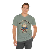Sage green crew-neck T-shirt with trophy-and-books chest graphic, worn with black pants