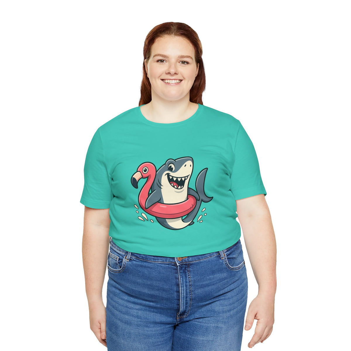 Teal crew-neck T-shirt with shark and flamingo floatie graphic, worn by woman