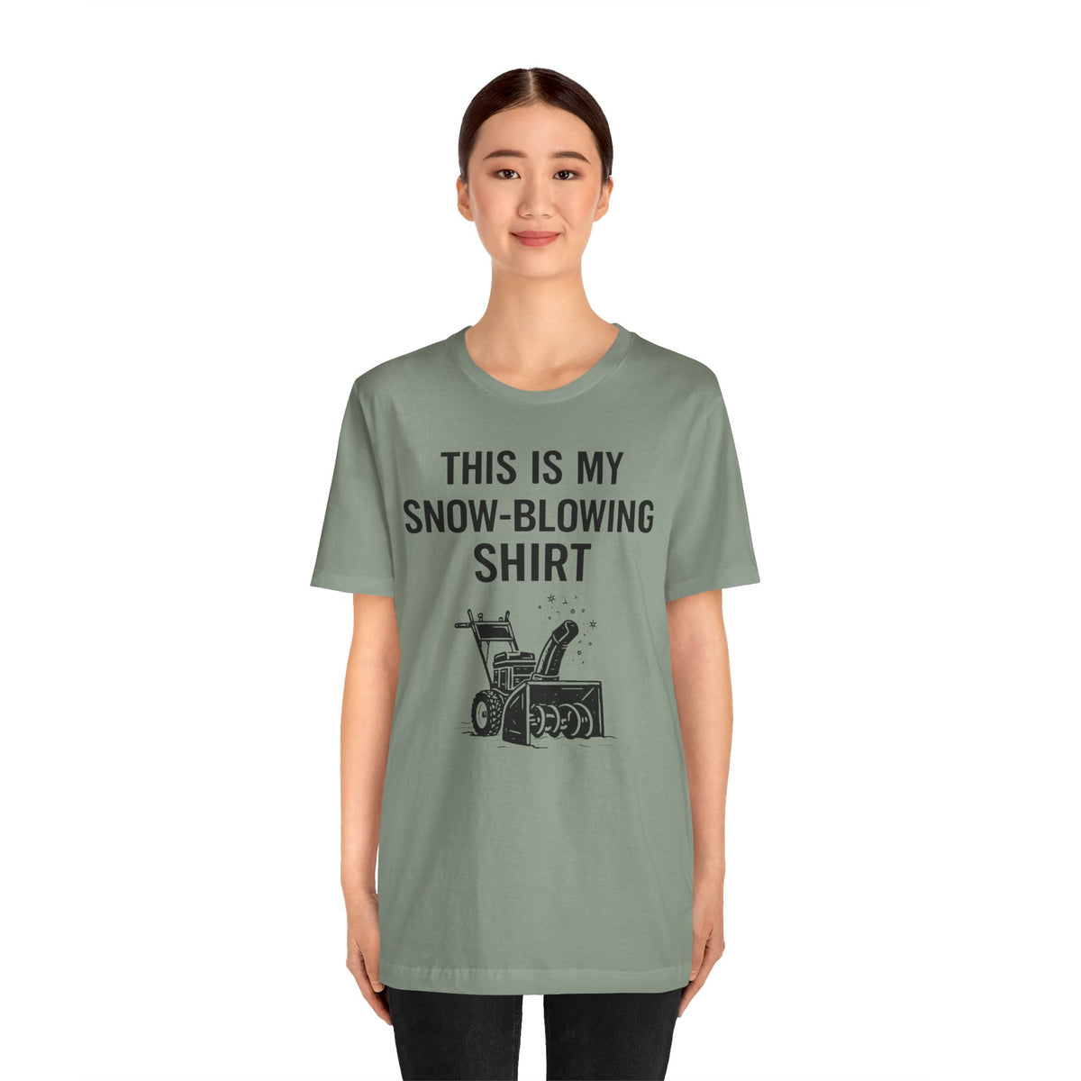 Green crewneck T-shirt with snow-blowing graphic and stacked lettering on chest