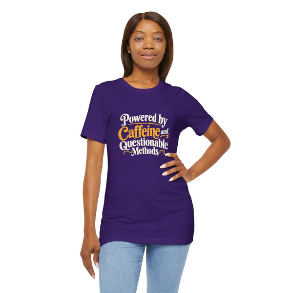 Purple crewneck T-shirt with front “Powered by Caffeine and Questionable Methods” graphic.