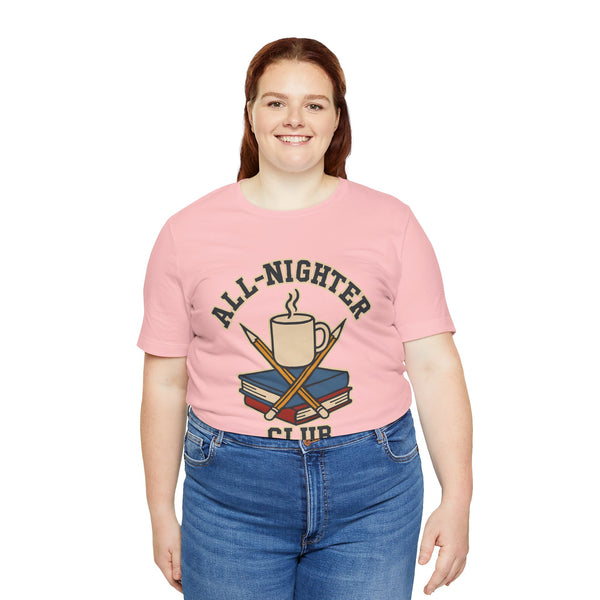 Pink crewneck T-shirt with centered “All-Nighter Club” coffee-and-books print